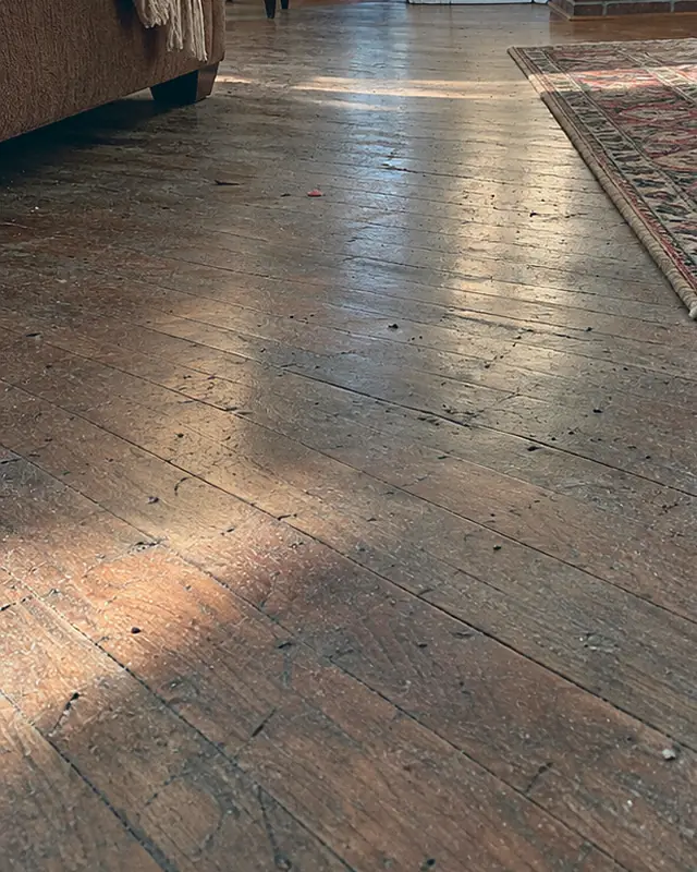 Example, before: a dull, scuffed hardwood floor