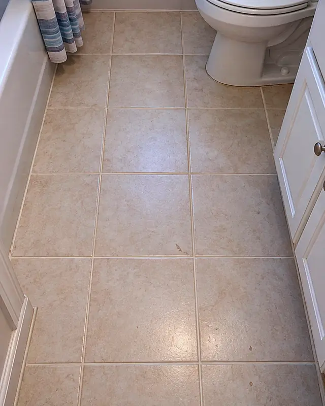 Example, after: dark grout lines in a bathroom