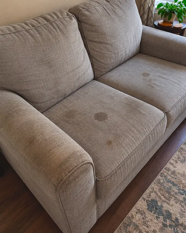 Example, before: spots on a fabric loveseat